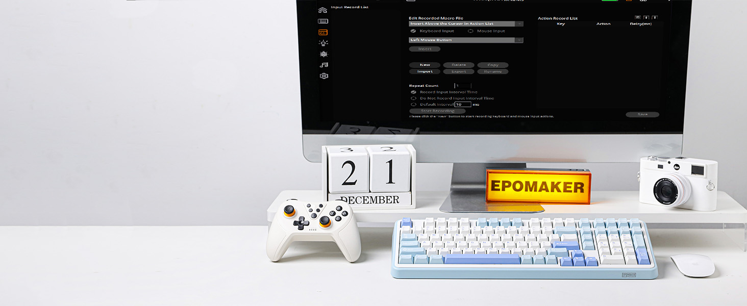 a desk with a computer and a calendar on it.