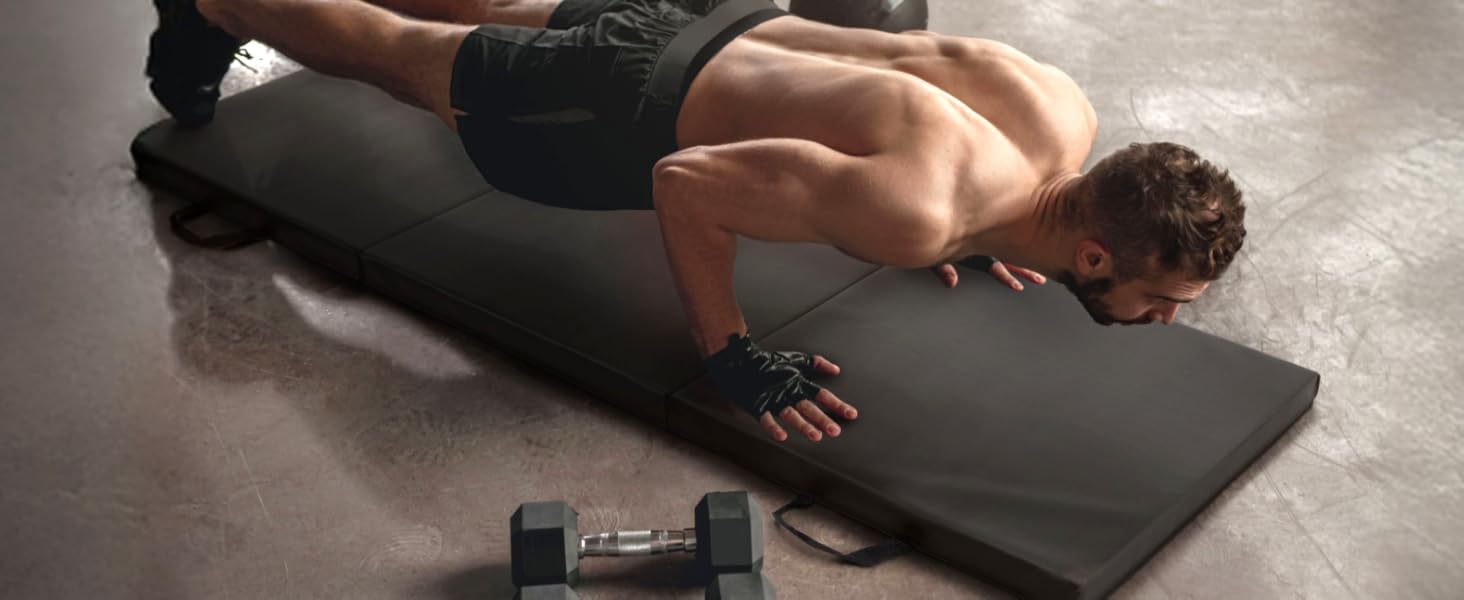 man doing push up in home gym with CAP exercise mat and dumbbells
