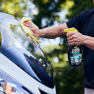 Invisible Glass Clear Plastic Cleaner being used to clean a motorcycle windshield