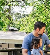 Family spending time together outside of their RV