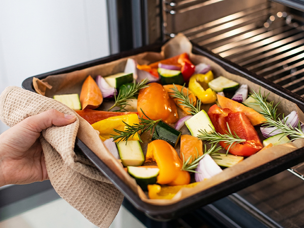 Zufaugc 9x13in precut parchment paper sheets for oven baking roasted vegetables.