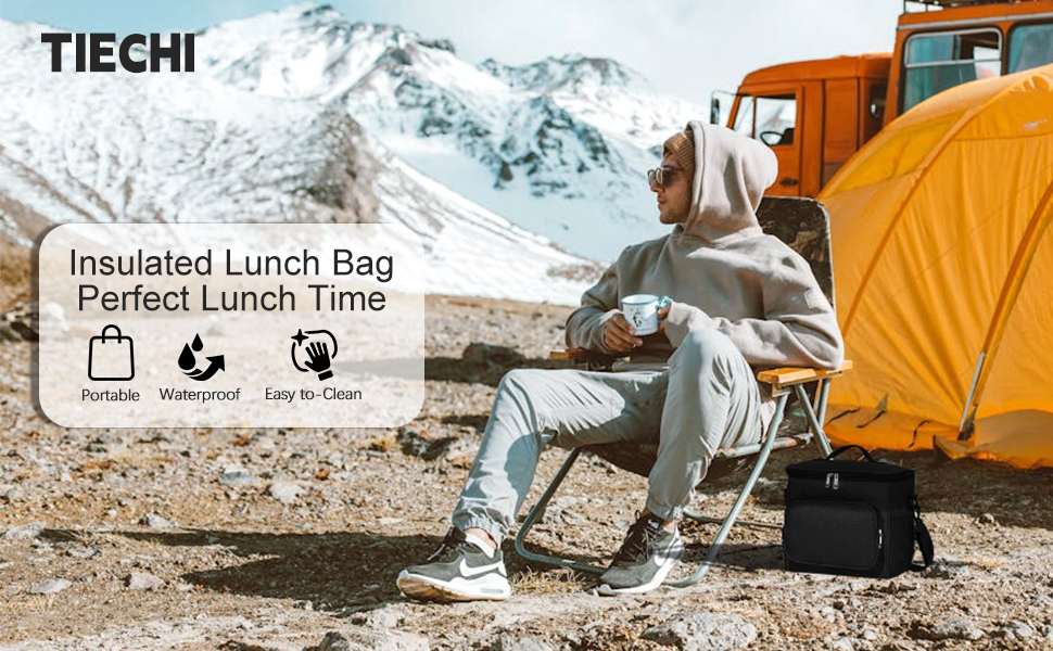 a man sitting in a chair in the mountains with a backpack and a backpack.