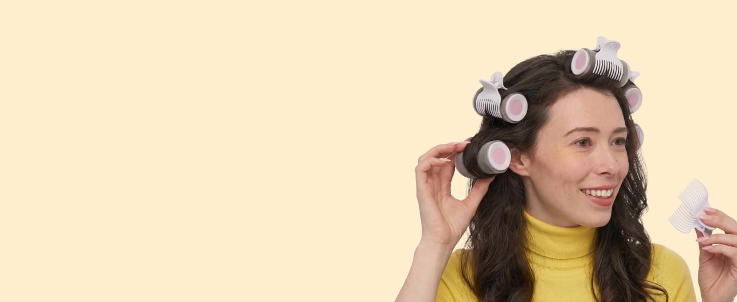 Woman using hot rollers