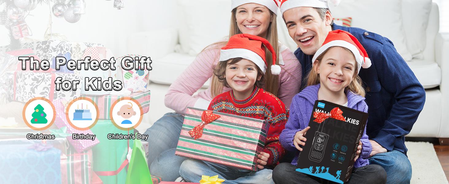 Text reads 'The Perfect Gift for Kids'. Holiday-themed promotional image showing wrapped presents and festive decorations.