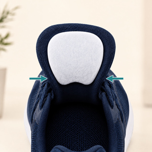 White felt tongue pad shown under a navy sneaker tongue.