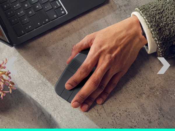 a person holding a foldable mouse