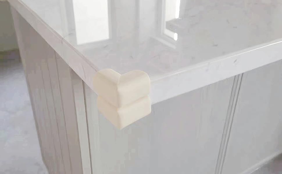 a white marble kitchen island with a white marble top