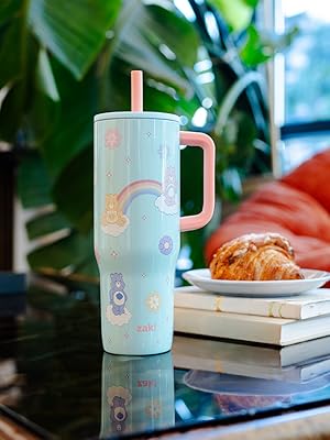 Care Bears stainless steel straw tumbler on glass coffee table