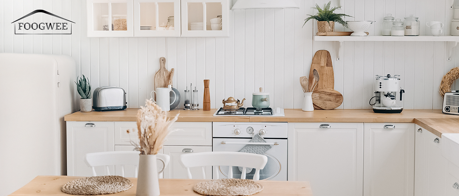White kitchen interior with wooden open shelving displaying cookware, plants, and decorative items against textured wall.