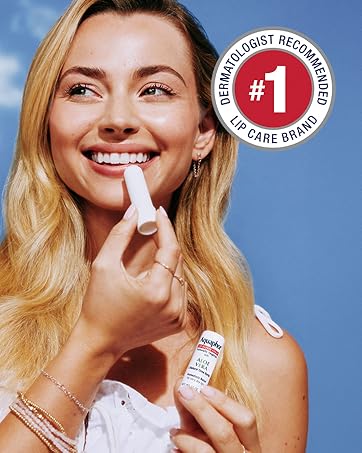 Naturally inspired. Beautifully hydrated. women putting on lip care.