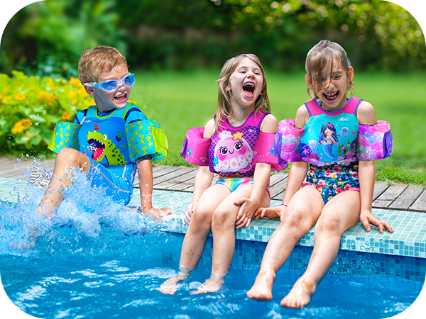 3 kids play water at pool