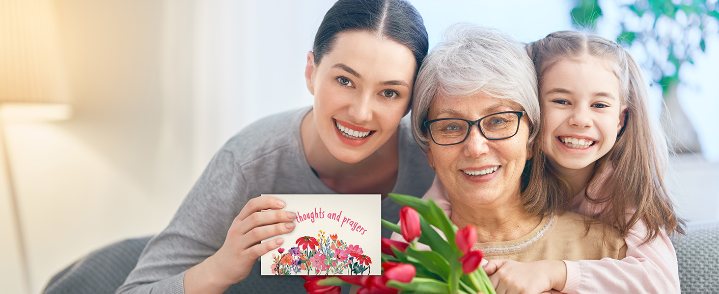 Daughter gives thinking of you greeting cards to appreciate her mother.