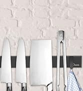Kitchen knife set displayed on a white textured wall, including chef's knives, cleaver, and kitchen tongs.