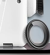 Close-up of a white electronic device with a circular lens or sensor, featuring a textured surface and a visible hinge or joint at the bottom.
