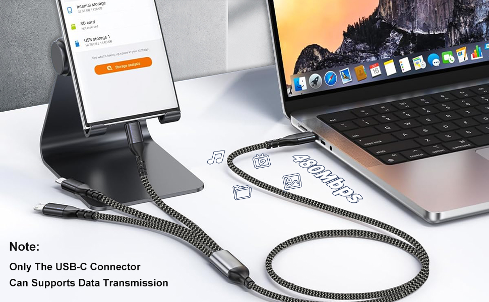 Black braided USB charging cable connected between a laptop and device, demonstrating data transmission capability. Cable features reinforced connectors and durable braided construction.