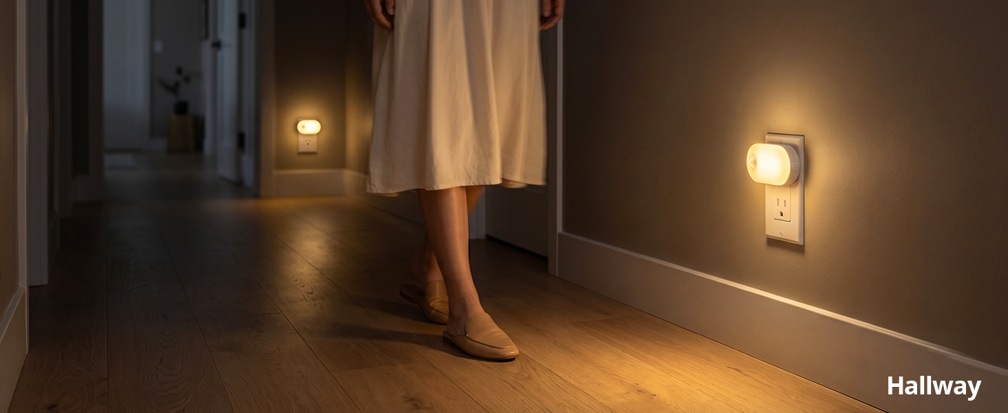Motion sensor plug-in night light illuminating a hallway.