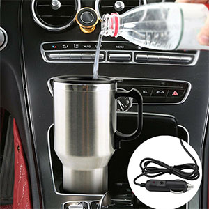 Car cup holder with stainless steel travel mug. Dashboard controls and gear shift visible. Electrical cord included, suggesting heating functionality.