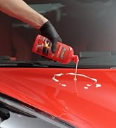 ceramic liquid wax being poured on the hood of a sports car
