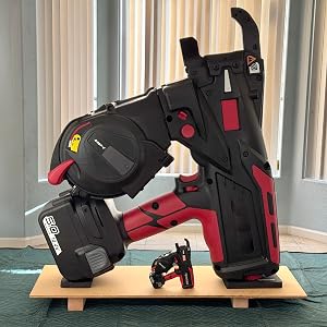 Giant 3D printed power tool with realistic detailing displayed next to a regular-size drill