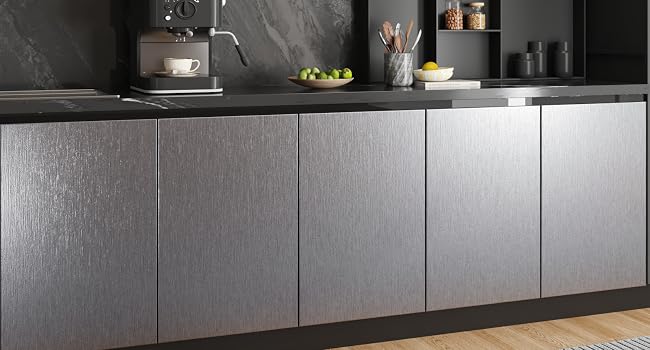 Modern dark kitchen cabinetry installation sequence showing sleek, handle-less cabinet fronts with consistent matte finish.