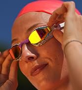 female wearing arena Air Sonic swim goggle in white with a fluorescent coral swim cap close up