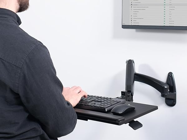 man typing on keyboard