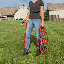 Woman holding 200 FT HydroTech Pro Series hose