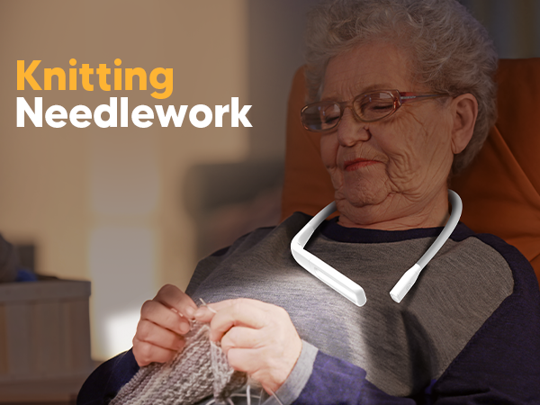 A old woman is knitting or crocheting with a neck light on for handsfrees convenient illumination