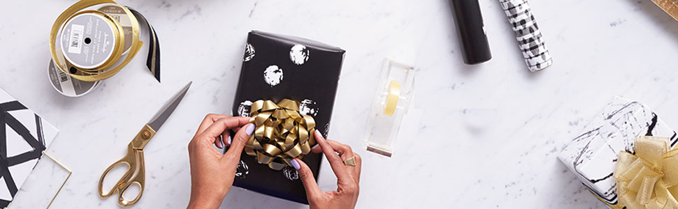 Beautiful gift wrap supplies by Hallmark including ribbon, bows, wrapping paper and tissue paper