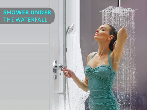 a woman is standing in a shower.