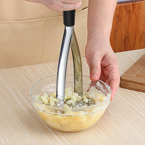 use potato masher to mash potatoes