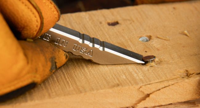 Shows milspin rhino bar being used to pry nail