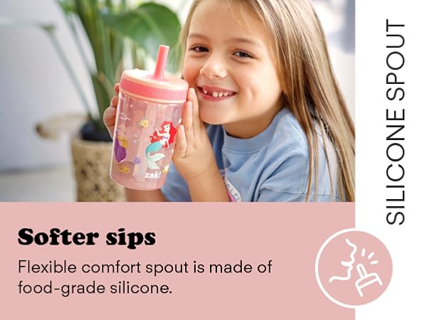 Photo of girl with Disney Princess Kelso tumbler and text calling out silicone spout feature