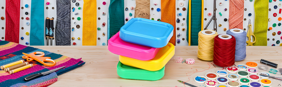 A colorful array of sewing supplies neatly arranged on a wooden table, with the product prominently