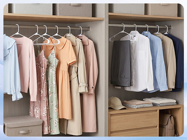 Walk-in closet organized with 50 white plastic hangers. Matching hangers create calm, boutique feel