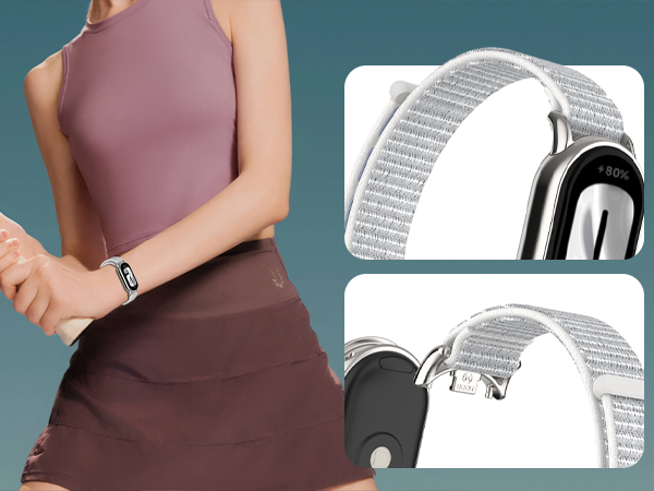 Fitness tracker with slim rectangular display worn on wrist. Close-ups show white woven fabric band and silver metal clasp mechanism for secure fit.