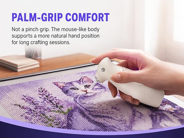 A hand uses the Ulverion electric diamond painting pen with a palm-grip design.