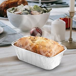 steaming hot bread in aluminum foil loaf tin pan
