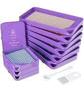 Stack of purple diamond painting storage containers or organizers with grid patterns, shown with accompanying accessories.
