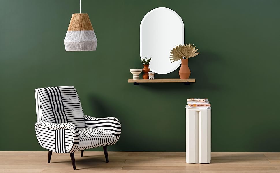 Green living room scene with oblong oval mirror