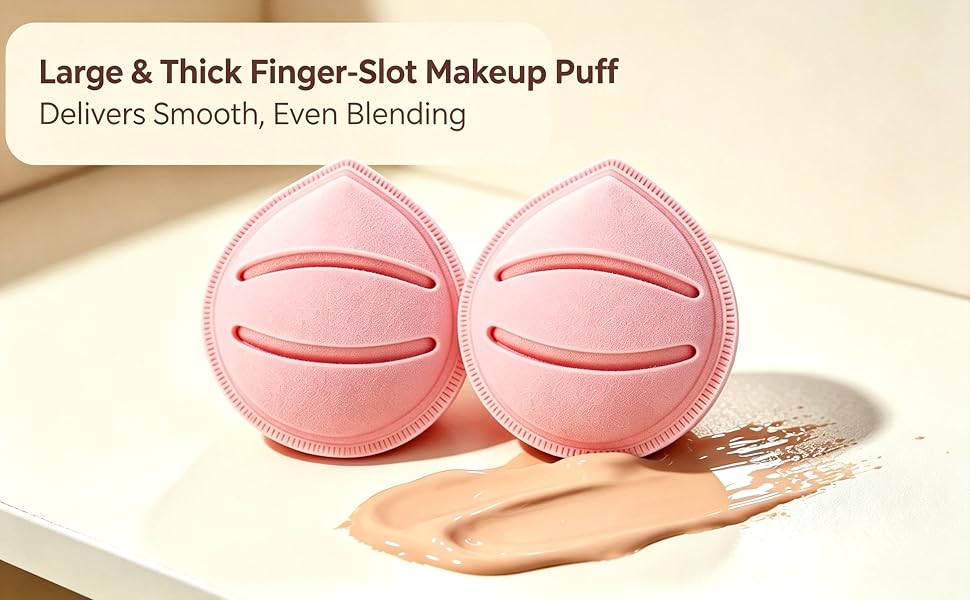 Large thick pink finger-slot makeup puffs next to liquid foundation for even makeup blending