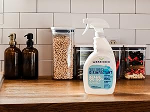 A bottle of Wondercide Multi-Surface Disinfectant Spray on the kitchen counter