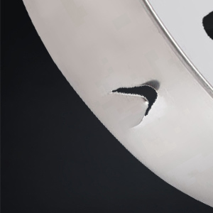 a silver plated car wheel with a silver plated logo.