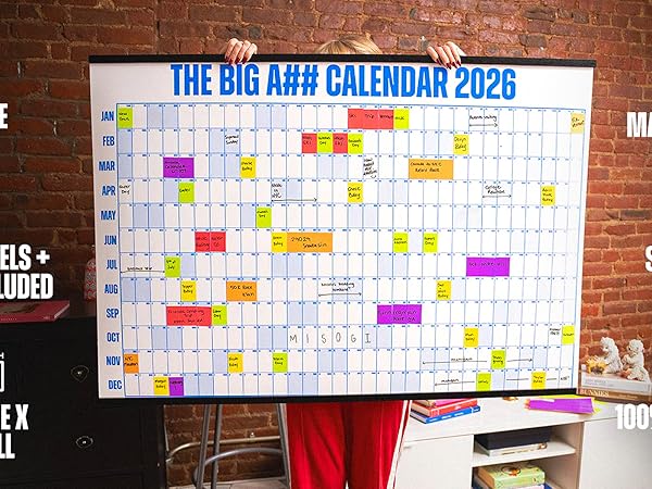 Woman holding a large wall calendar