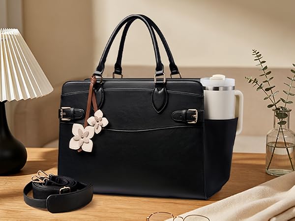 Side cup holder keeps your tumbler within reach. Adjustable strap for shoulder or crossbody wear.