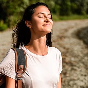 woman outside hiking breathing better with nasal strip