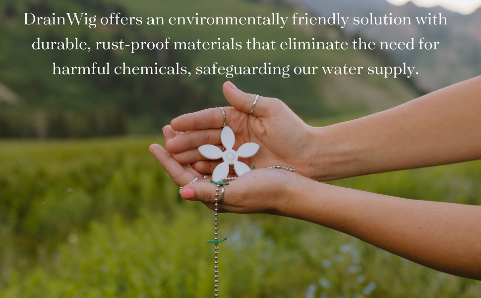hand holding drainwig in a feild