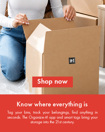 Woman assembling a cardboard moving box with Organize-it! smart tag