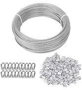 Stainless steel wire rope coil with accompanying metal clamps and white aluminum ferrules. The wire is tightly wound, and the accessories are neatly arranged below.
