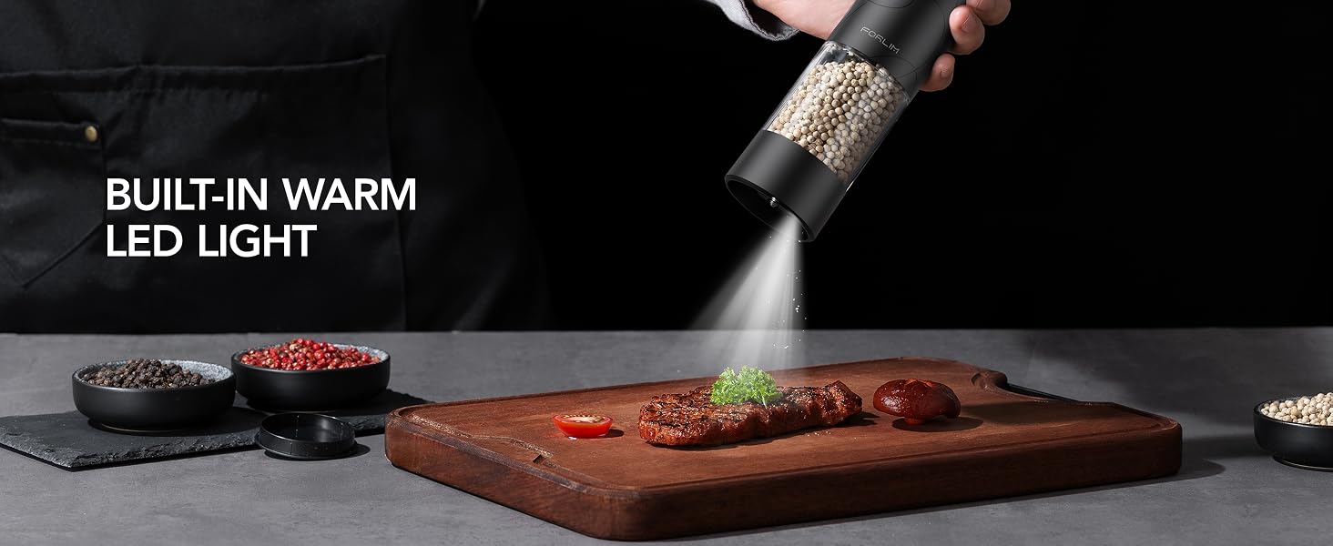 FORLIM electric grinder with built-in white LED light seasoning steak on a cutting board